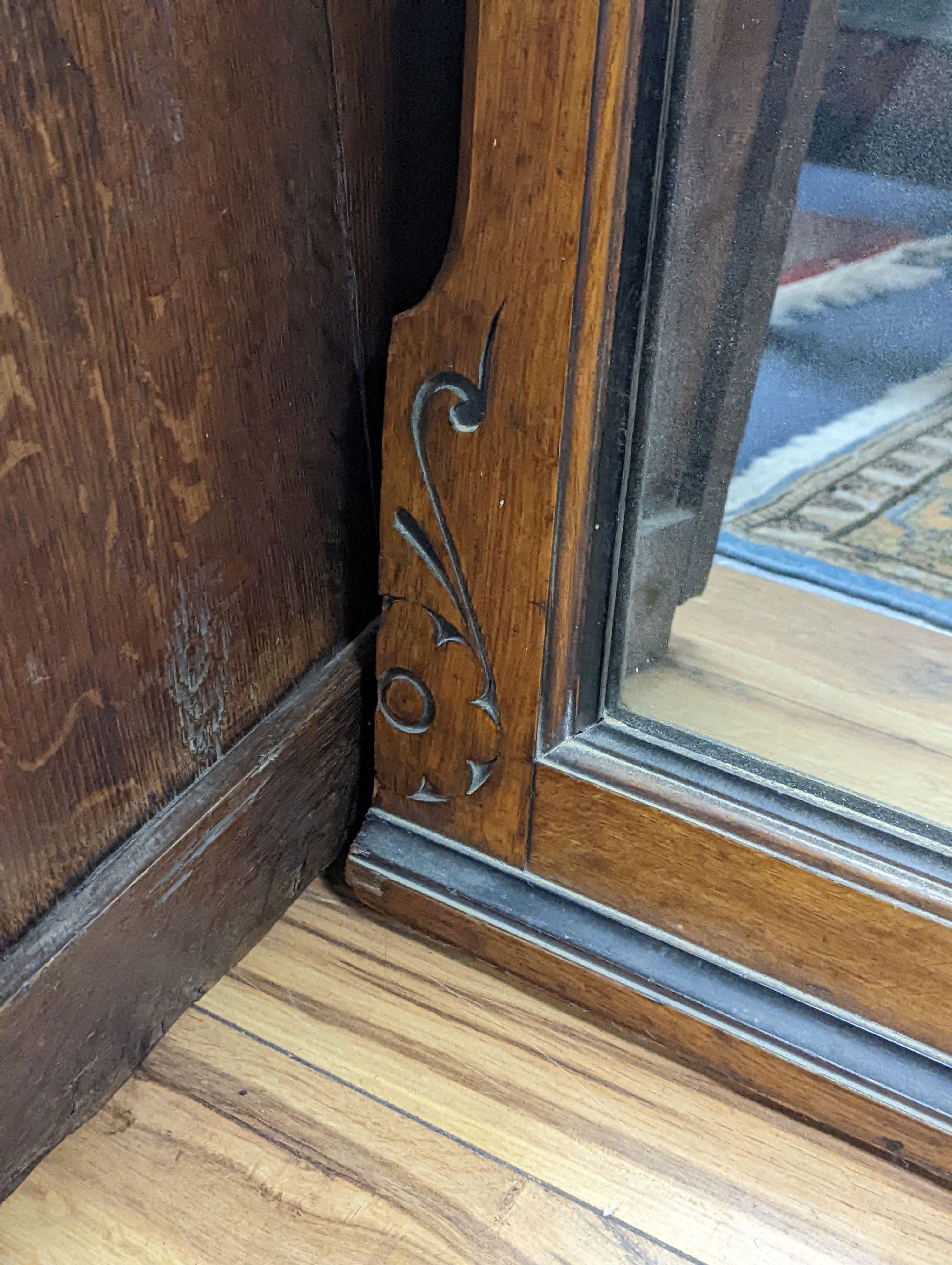 A large late Victorian aesthetic movement part ebonised oak overmantel mirror, width 162cm, height 197cm